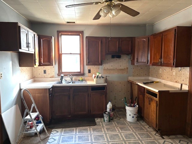 301 South Grape Street Morrison, IL 61270 - Photo 8 of 25 a kitchen with a sink window and cabinets