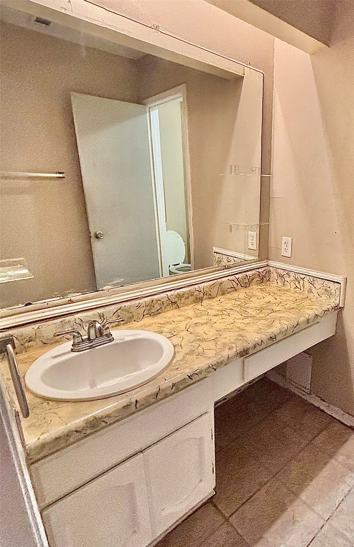 6234 Brookgate Drive Spring, TX 77373 - Photo 12 of 15 a bathroom with a granite countertop sink and a mirror