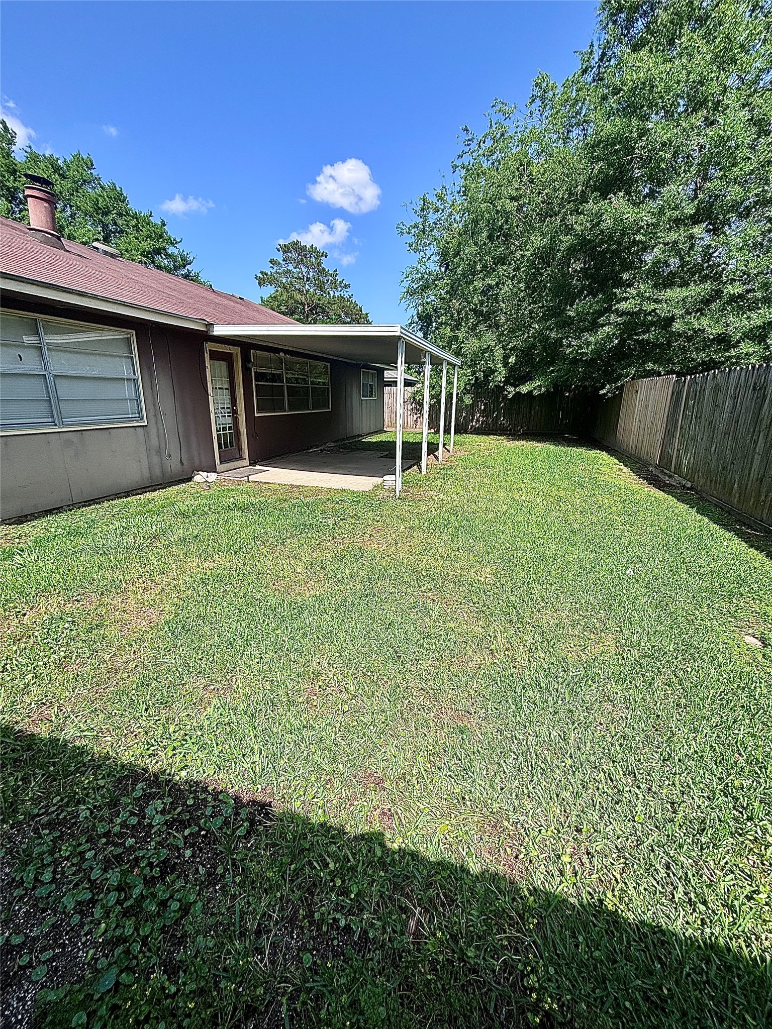 6234 Brookgate Drive Spring, TX 77373 - Photo 15 of 15 a view of a backyard with a garden