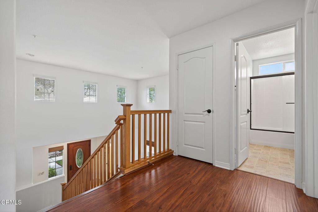 520 Festivo Street Oxnard, CA 93030 - Photo 14 of 31 a view of a hallway with wooden floor and entryway