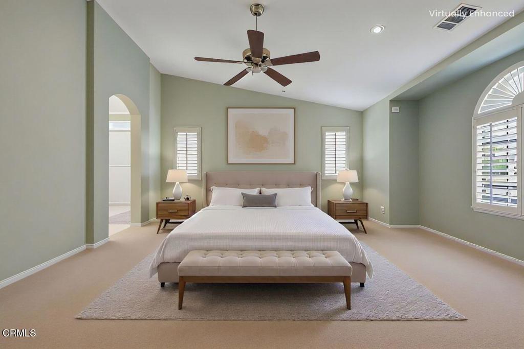 520 Festivo Street Oxnard, CA 93030 - Photo 18 of 31 a bedroom with a bed and a chandelier