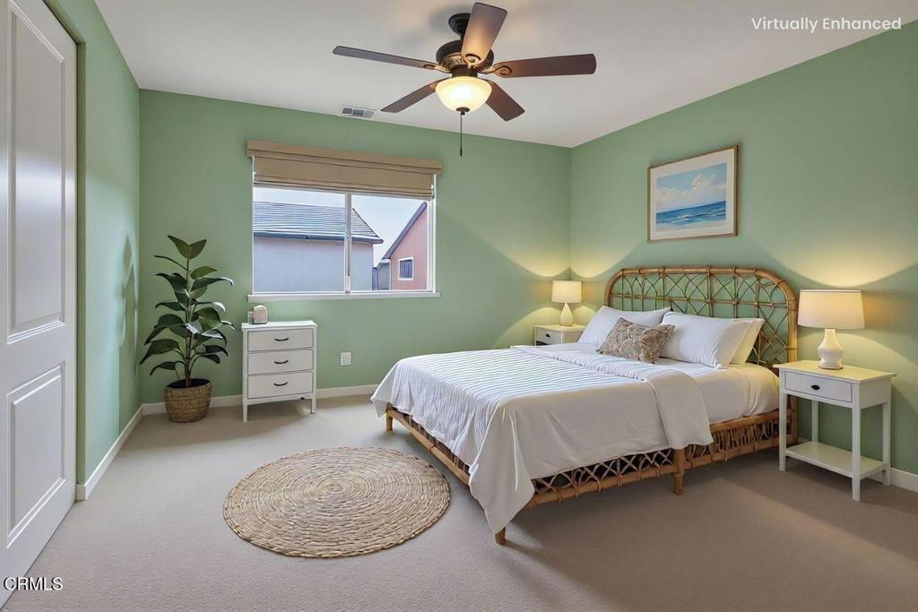 520 Festivo Street Oxnard, CA 93030 - Photo 24 of 31 a bedroom with a bed and a chandelier