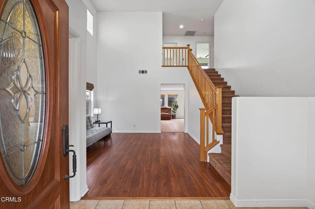 520 Festivo Street Oxnard, CA 93030 - Photo 3 of 31 a view of a livingroom with wooden floor and stairs