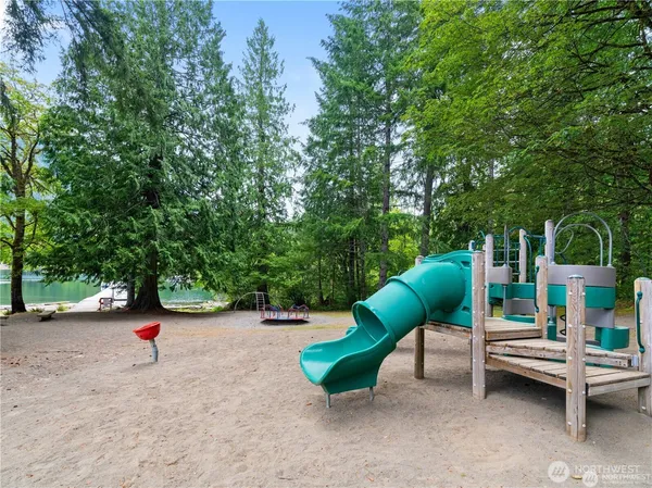 swimming pool view with a seating space