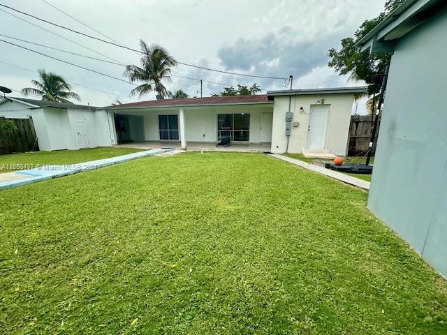 29605 Southwest 154th Court Homestead, FL 33033 - Photo 16 of 25 a front view of a house with a garden and plants