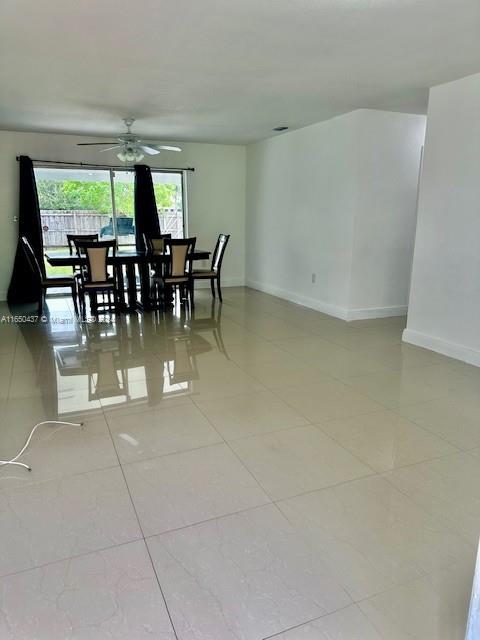 29605 Southwest 154th Court Homestead, FL 33033 - Photo 2 of 25 a view of a dining room with furniture and floor to ceiling window