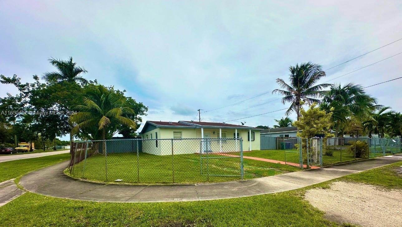 29605 Southwest 154th Court Homestead, FL 33033 - Photo 24 of 25 a view of a house with a yard