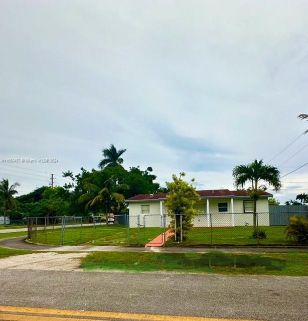 29605 Southwest 154th Court Homestead, FL 33033 - Photo 25 of 25 a front view of a house with a yard and trees