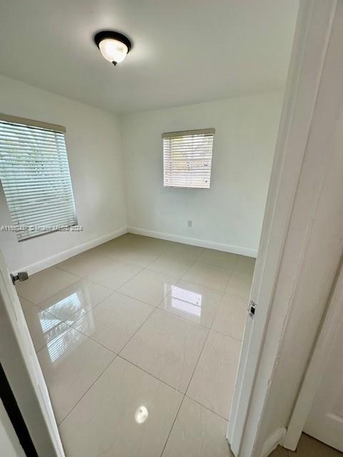 29605 Southwest 154th Court Homestead, FL 33033 - Photo 4 of 25 an empty room with a white cabinet door