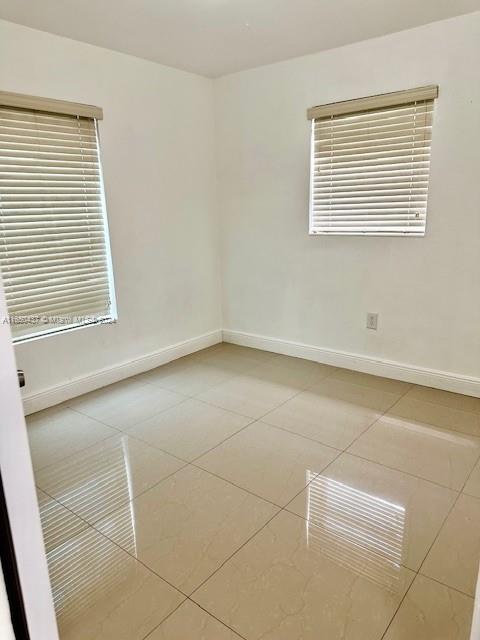29605 Southwest 154th Court Homestead, FL 33033 - Photo 7 of 25 an empty room with a window