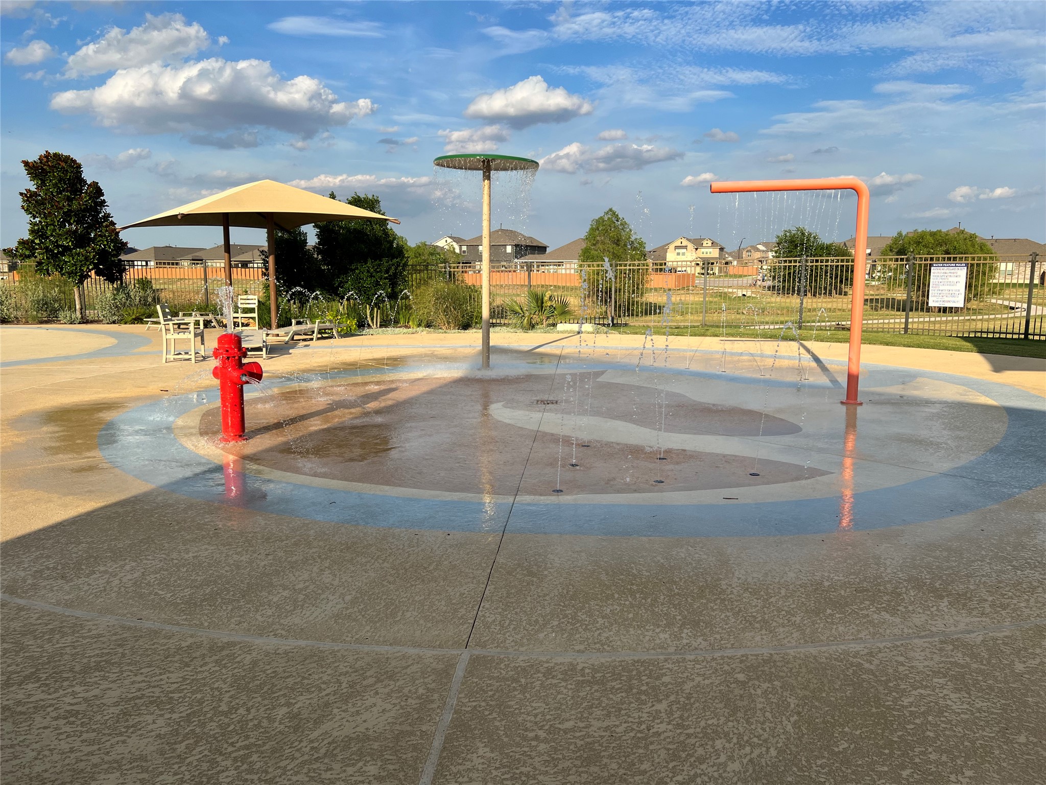 140 Pentro Path Georgetown, TX 78626 - Photo 28 of 37 A vibrant splash pad with playful water features offers a refreshing community amenity.