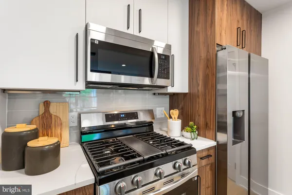 a kitchen with a stove and a microwave