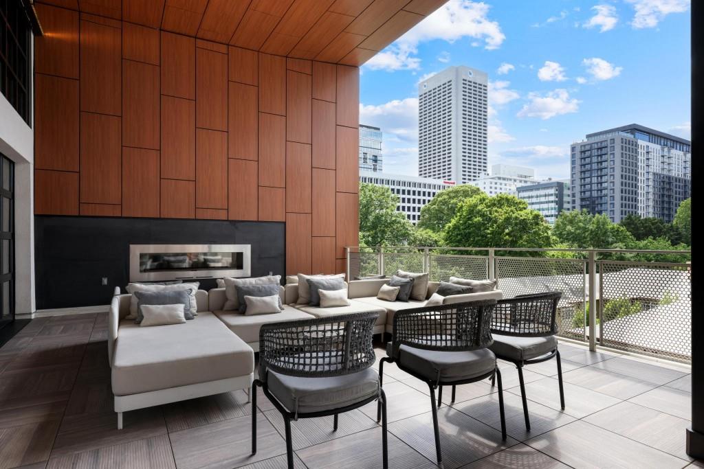 775 Juniper Street Northeast, Unit 602 Atlanta, GA 30308 - Photo 35 of 40 a view of a terrace with furniture and a potted plant
