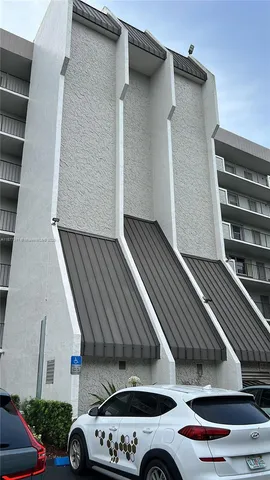 a view of roof deck with car parked