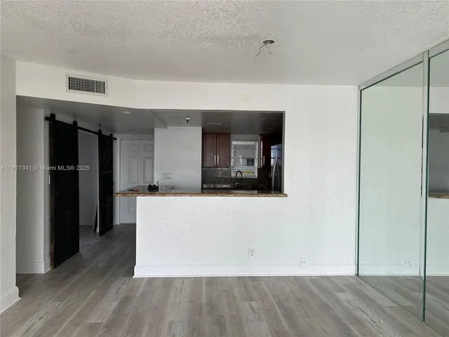 a living room with a wooden floor