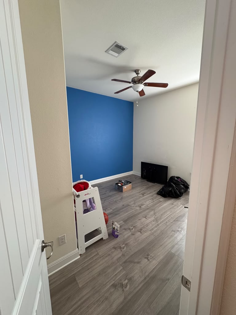3812 Alpine Rdg Cove Leander, TX 78641 - Photo 10 of 37 A versatile room features resilient wood-look flooring and a ceiling fan for comfort.