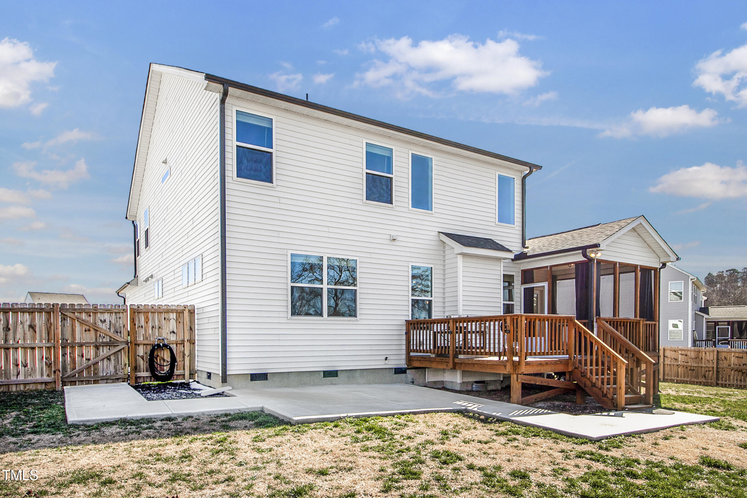 4412 Beckel Road Willow Spring, NC 27592 - Photo 5 of 17 a backyard of a house with barbeque oven table and chairs