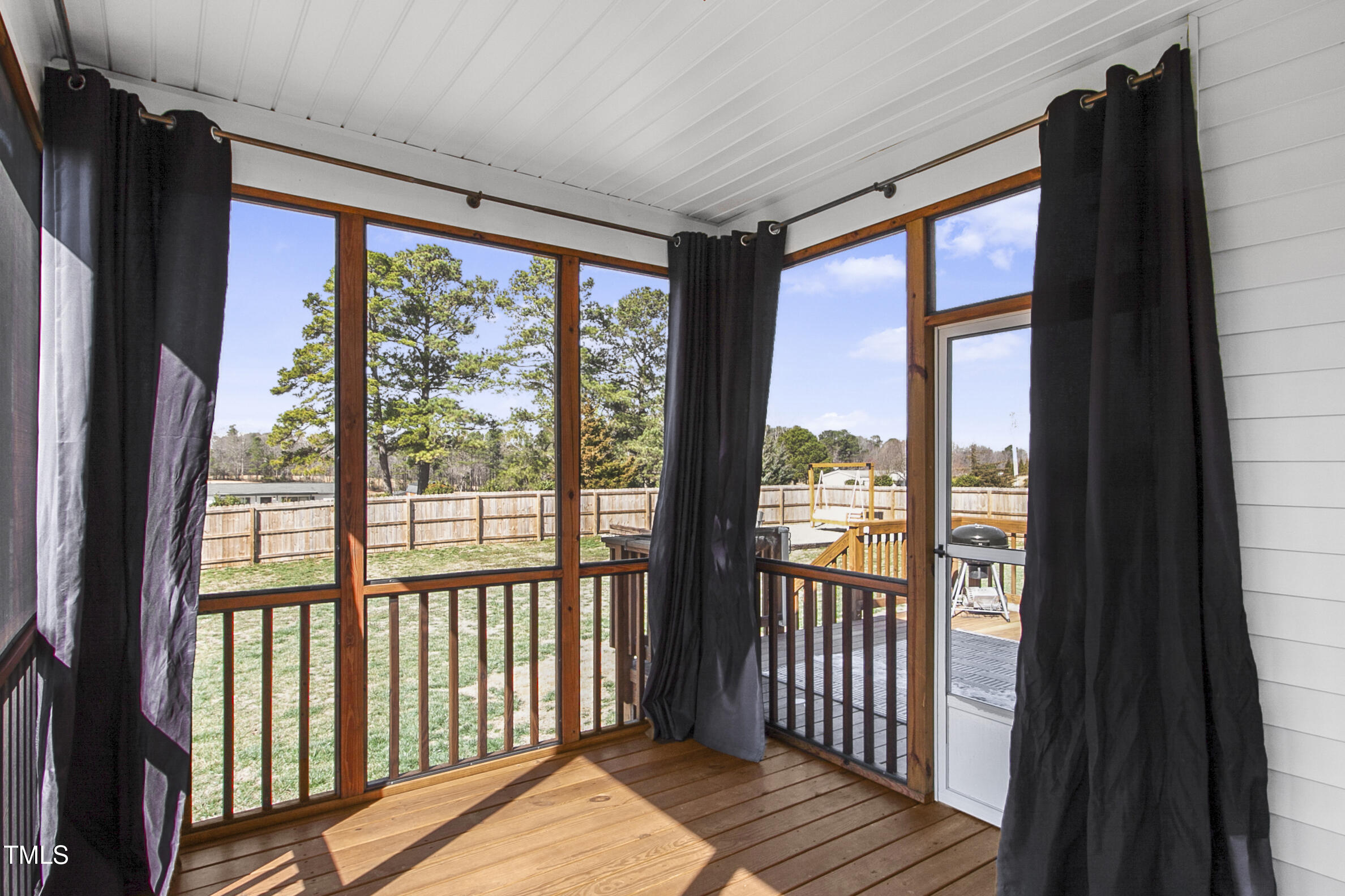 4412 Beckel Road Willow Spring, NC 27592 - Photo 8 of 17 a view of a large window with wooden floor