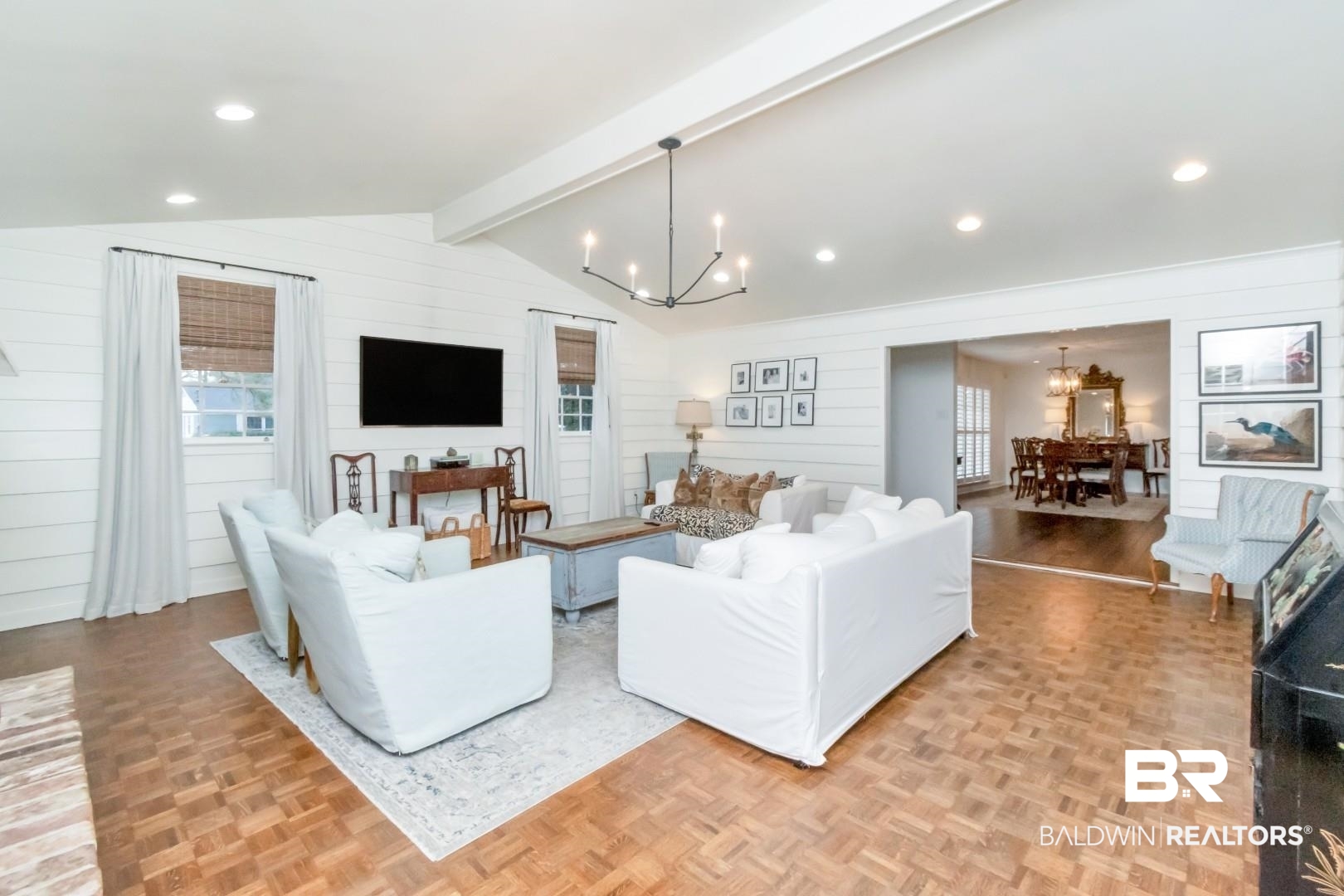 154 Fenwick Road Mobile, AL 36608 - Photo 7 of 48 Living area with hanging lights, parquet floors, plenty of natural light, wooden walls, and beam ceiling