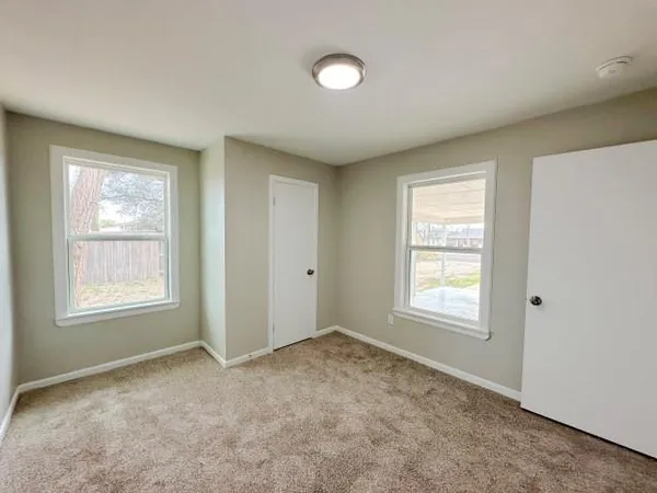 an empty room with windows