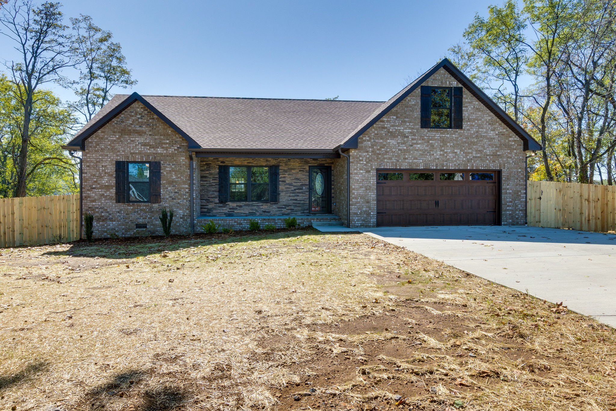 7703 South Swift Road Goodlettsville, TN 37072 - Photo 1 of 12 a front view of a house with a yard and garage