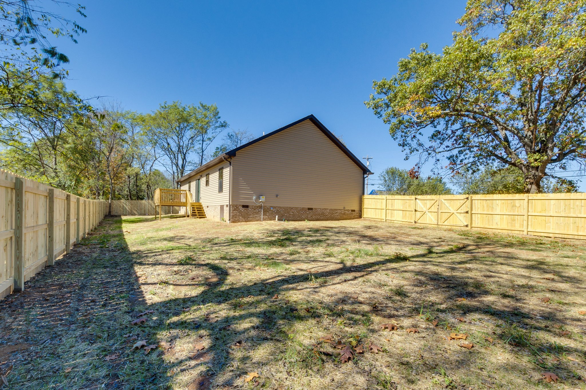 7703 South Swift Road Goodlettsville, TN 37072 - Photo 8 of 12 a view of house with backyard and tree
