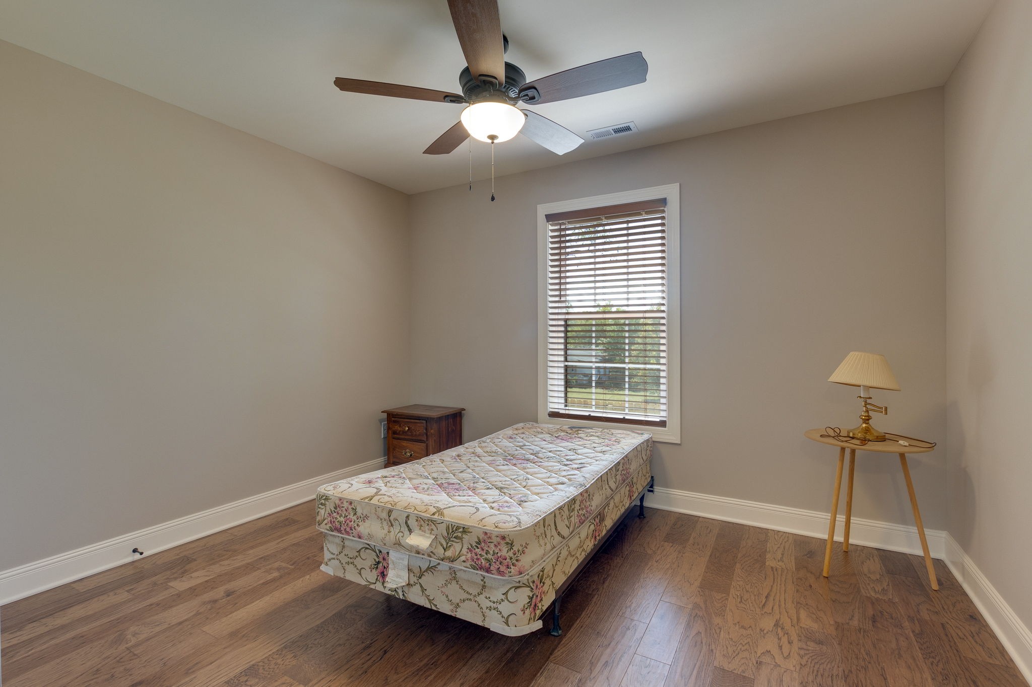 7703 South Swift Road Goodlettsville, TN 37072 - Photo 10 of 12 a bedroom with a bed and a window