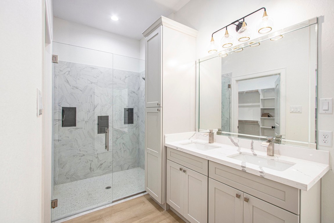 3810 Jackson Street Santa Fe, TX 77517 - Photo 14 of 29 a bathroom with a shower sink and mirror