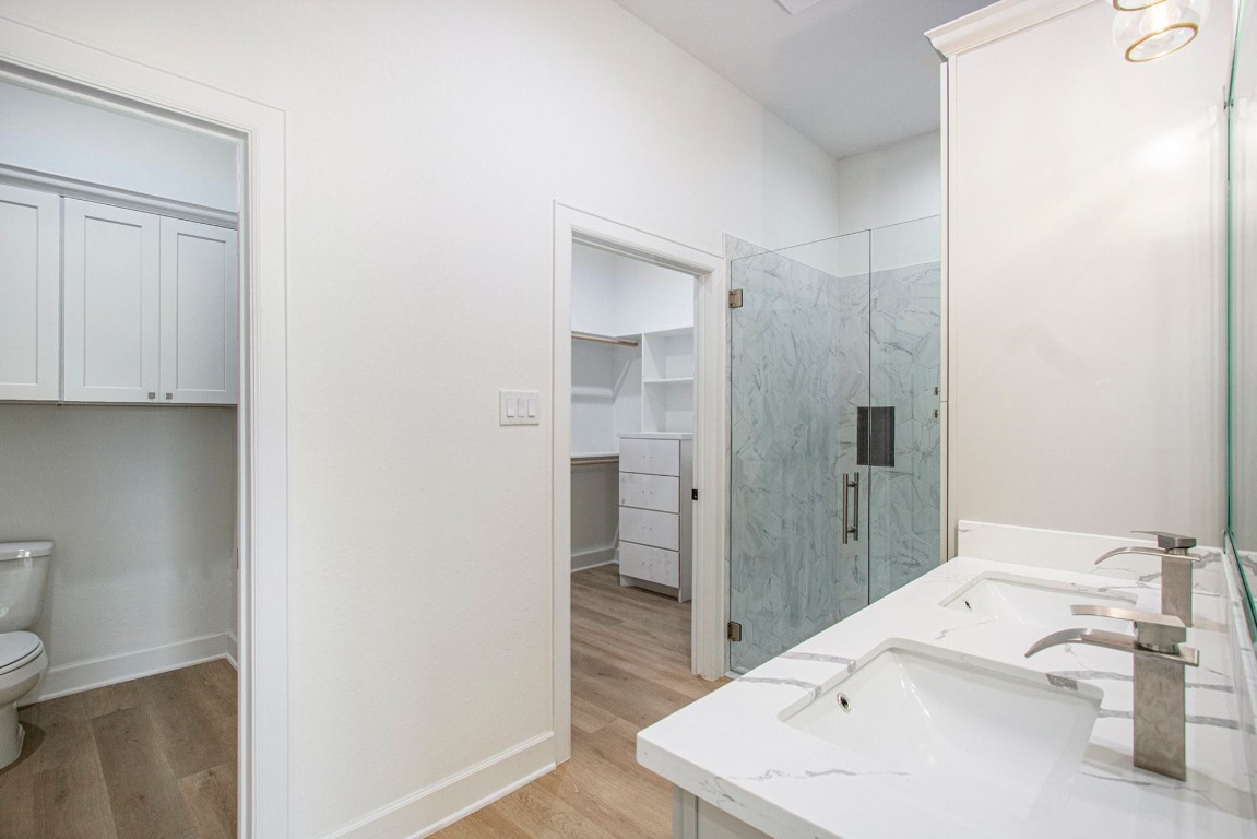 3810 Jackson Street Santa Fe, TX 77517 - Photo 15 of 29 a bathroom with a sink a toilet and shower