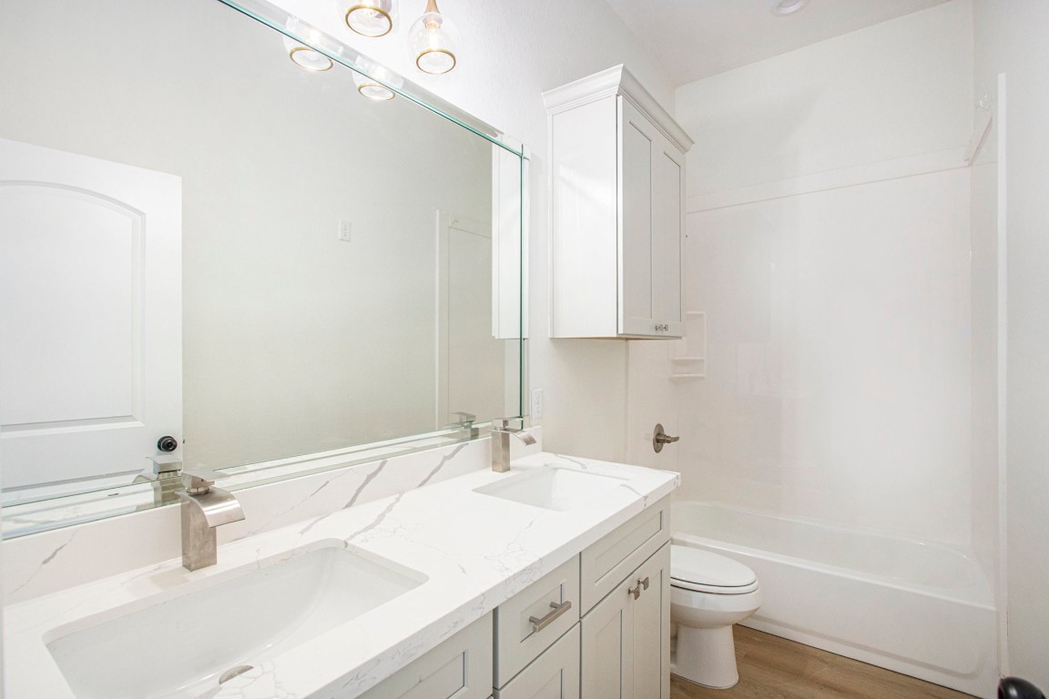 3810 Jackson Street Santa Fe, TX 77517 - Photo 21 of 29 a bathroom with a sink and a mirror
