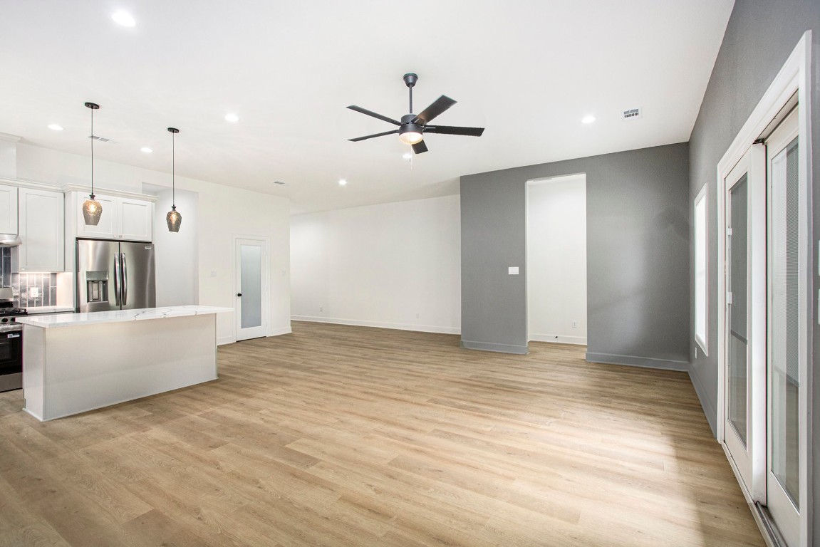 3810 Jackson Street Santa Fe, TX 77517 - Photo 5 of 29 a view of an empty room with window and a ceiling fan