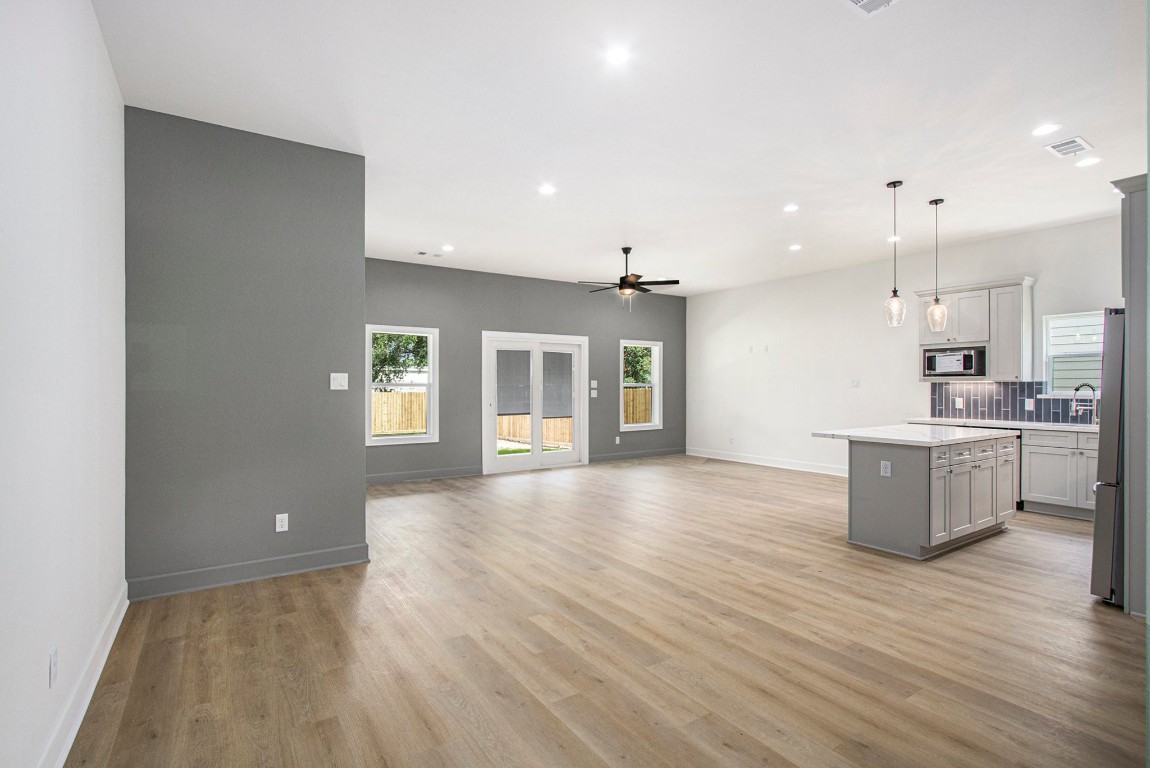 3810 Jackson Street Santa Fe, TX 77517 - Photo 6 of 29 a view of an empty room with window and wooden floor