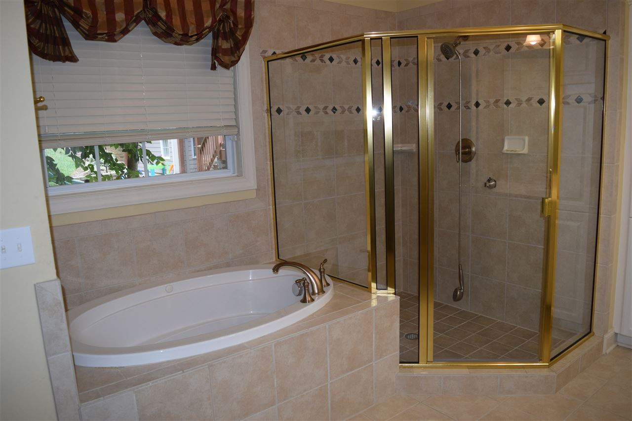 9307 Tabriz Point Raleigh, NC 27614 - Photo 16 of 24 Large bath with whirlpool tub and separate shower. Master bath spa