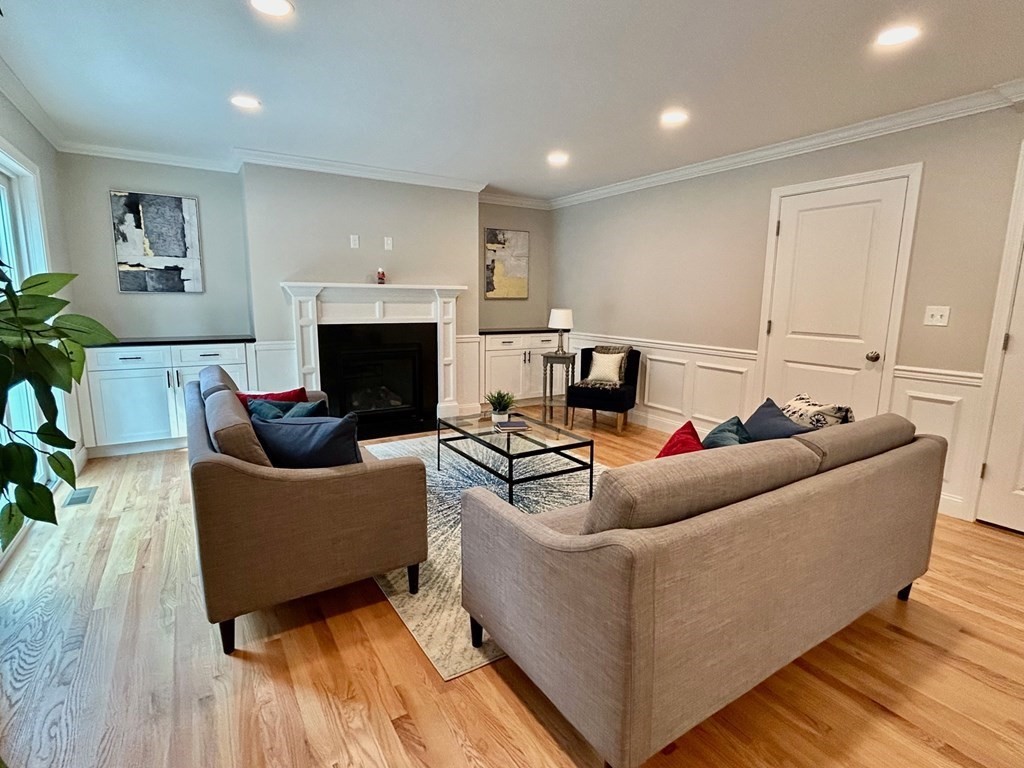 33 Circle Drive Waltham, MA 02452 - Photo 11 of 42 a living room with furniture and a fireplace