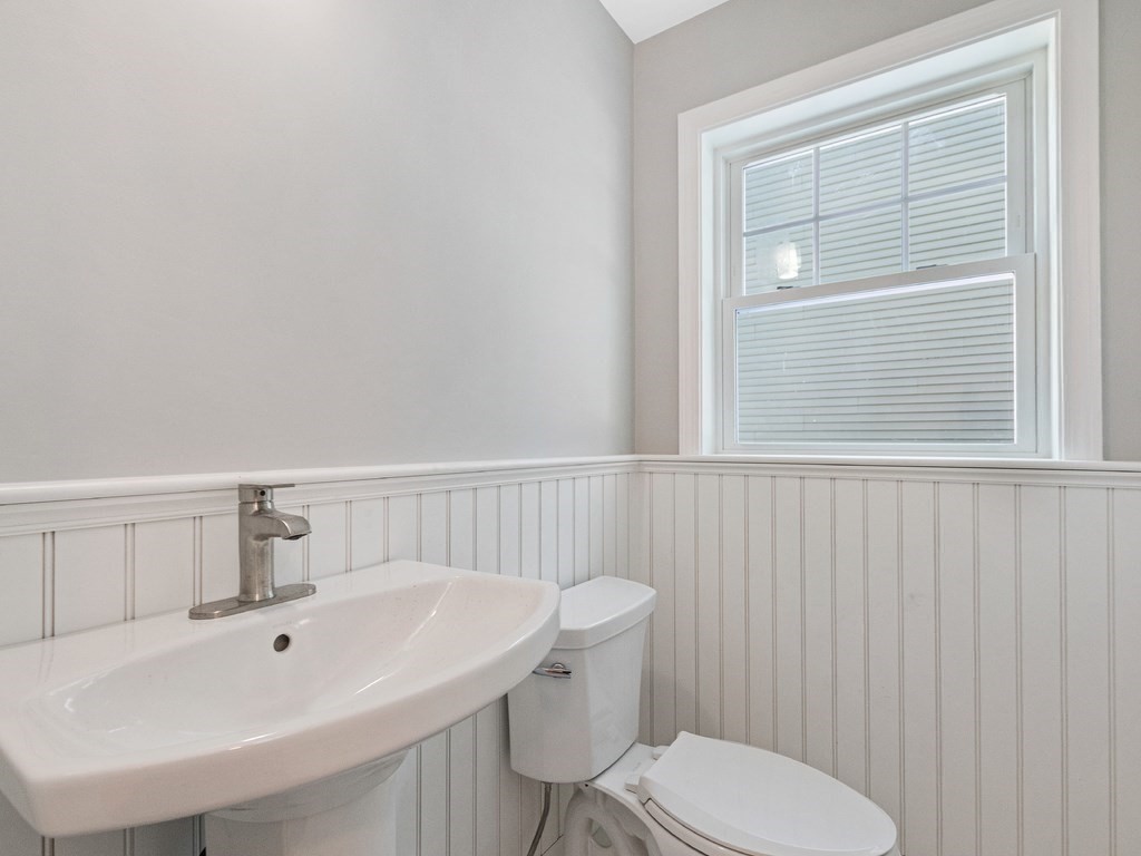 33 Circle Drive Waltham, MA 02452 - Photo 20 of 42 a bathroom with a sink a toilet and mirror