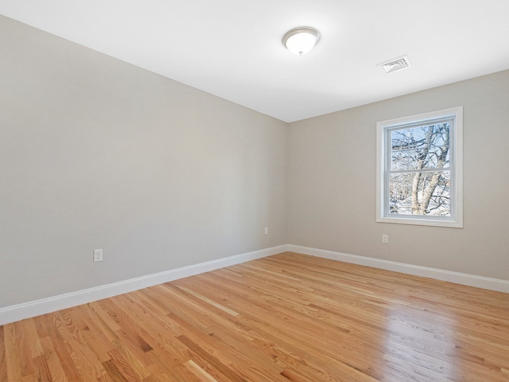 33 Circle Drive Waltham, MA 02452 - Photo 32 of 42 wooden floor in an empty room with a window