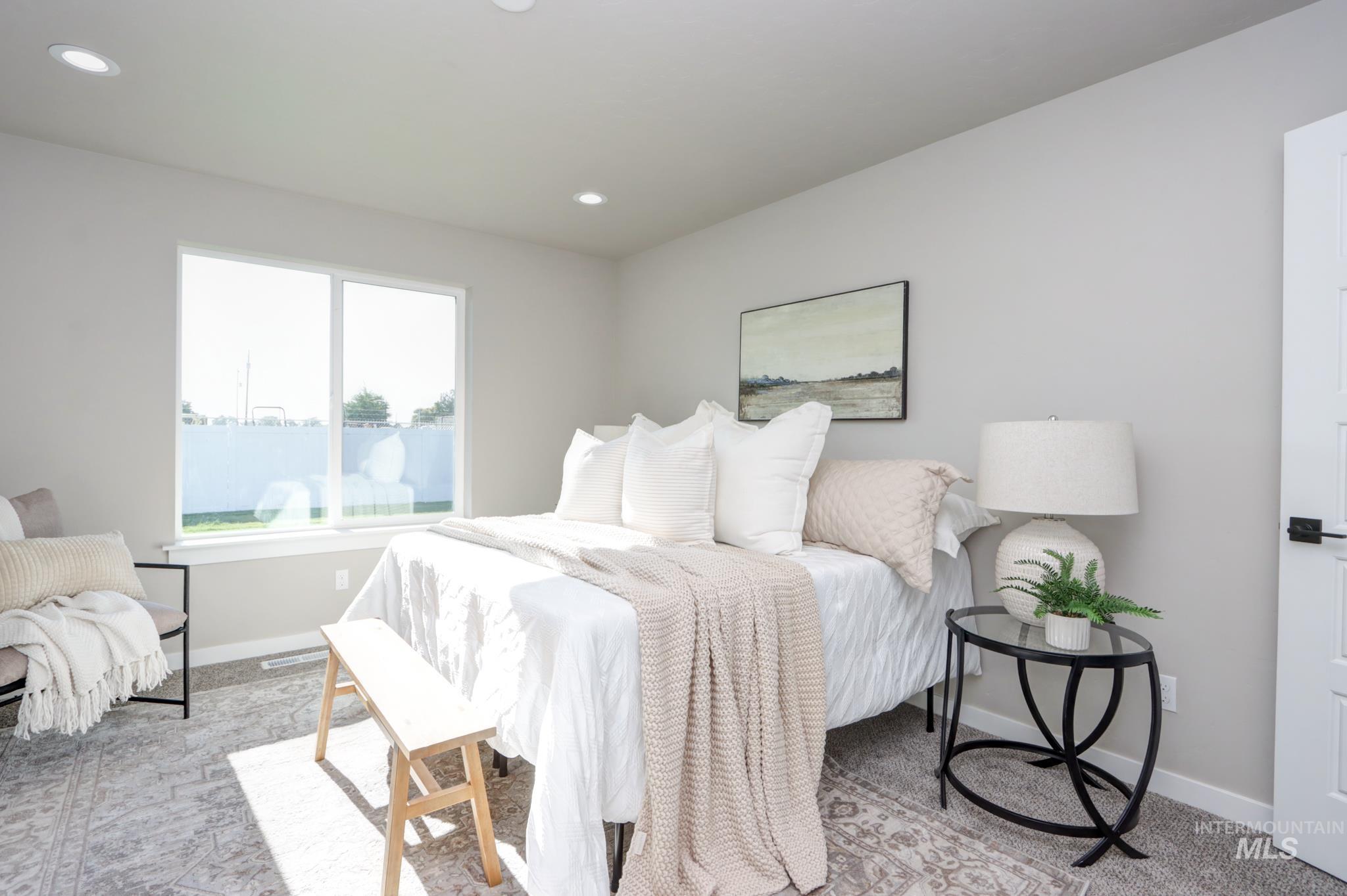 848 North 5th Street Nyssa, OR 97913 - Photo 14 of 49 Spacious room featuring a large window, recessed lighting, and soft gray wall tones