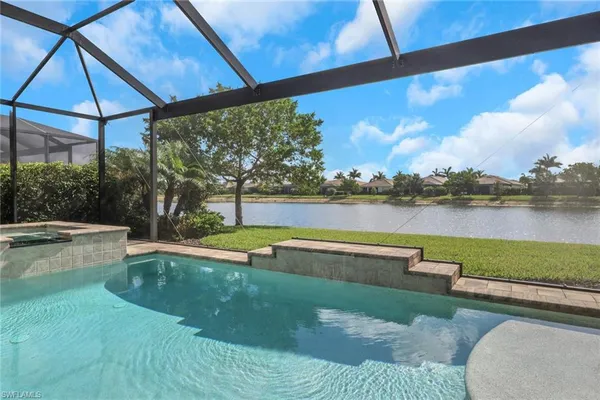 a view of a swimming pool with a patio