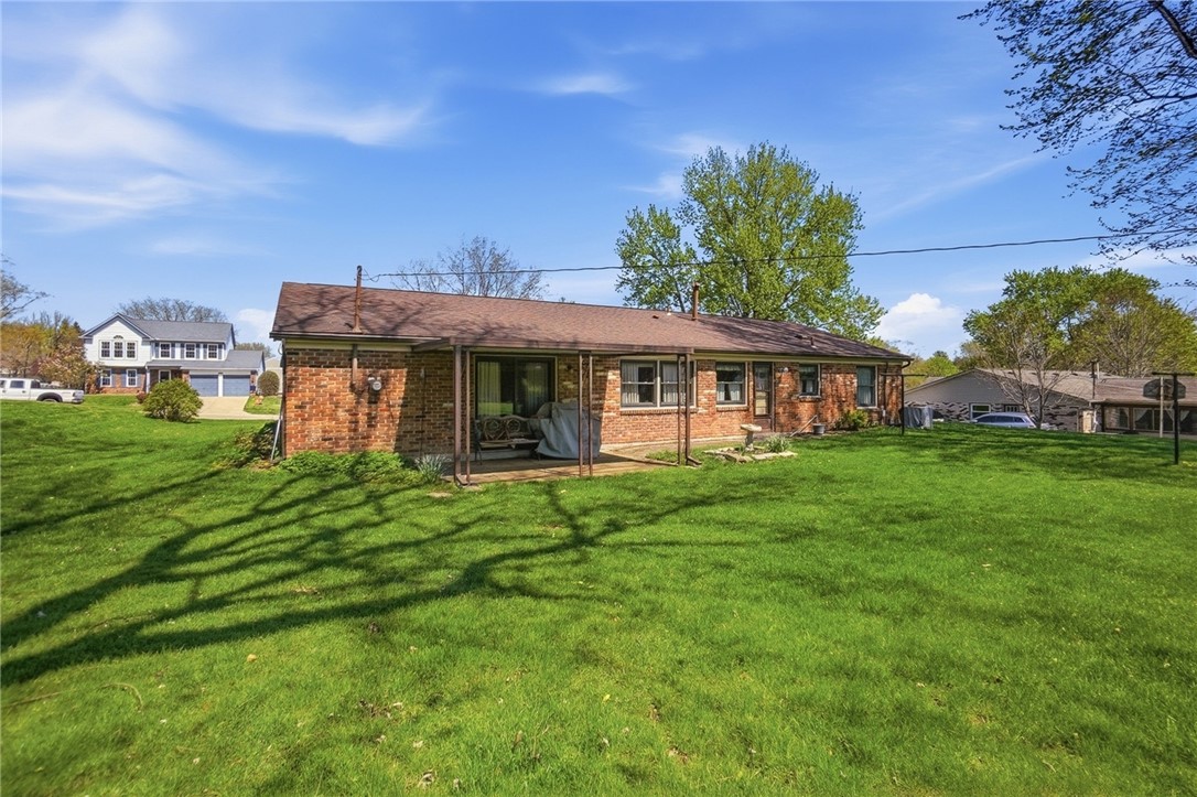 6225 Possum Run Road Bellbrook, OH 45305 - Photo 28 of 33 This residence features a brick exterior and a well-maintained yard.