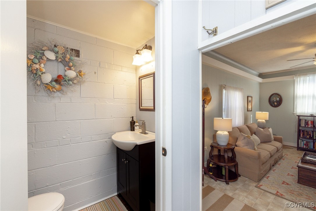 7518 Comet Road Henrico, VA 23294 - Photo 23 of 46 Half Bathroom featuring a vanity, toilet, and ligh