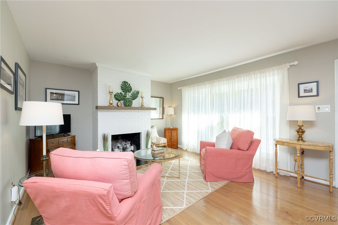 7518 Comet Road Henrico, VA 23294 - Photo 8 of 46 Cozy living room with hardwood flooring and a gas