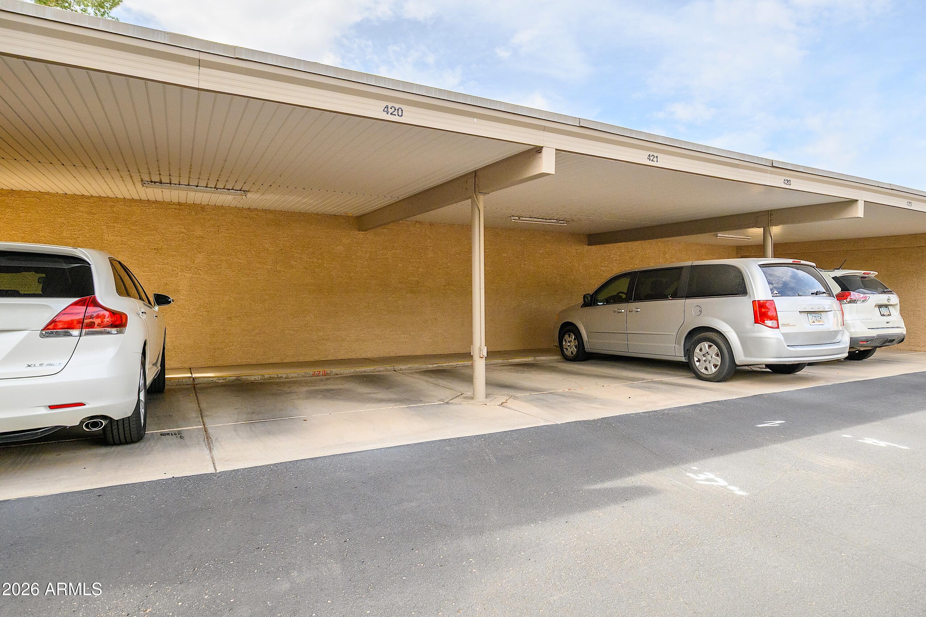 14300 West Bell Road, Unit 420 Surprise, AZ 85374 - Photo 24 of 27 a car parked in parking lot