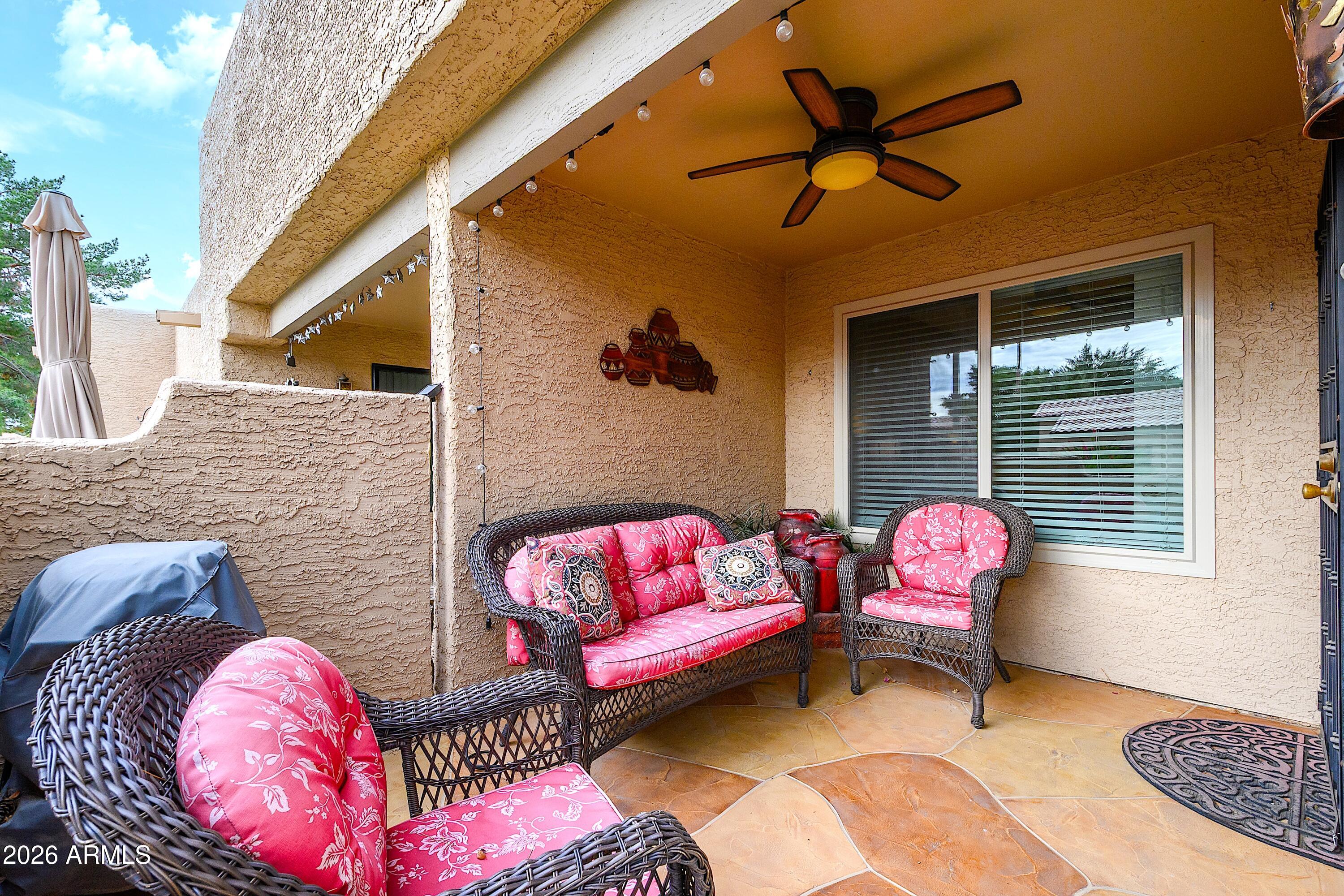14300 West Bell Road, Unit 420 Surprise, AZ 85374 - Photo 3 of 27 a view of a balcony with couch