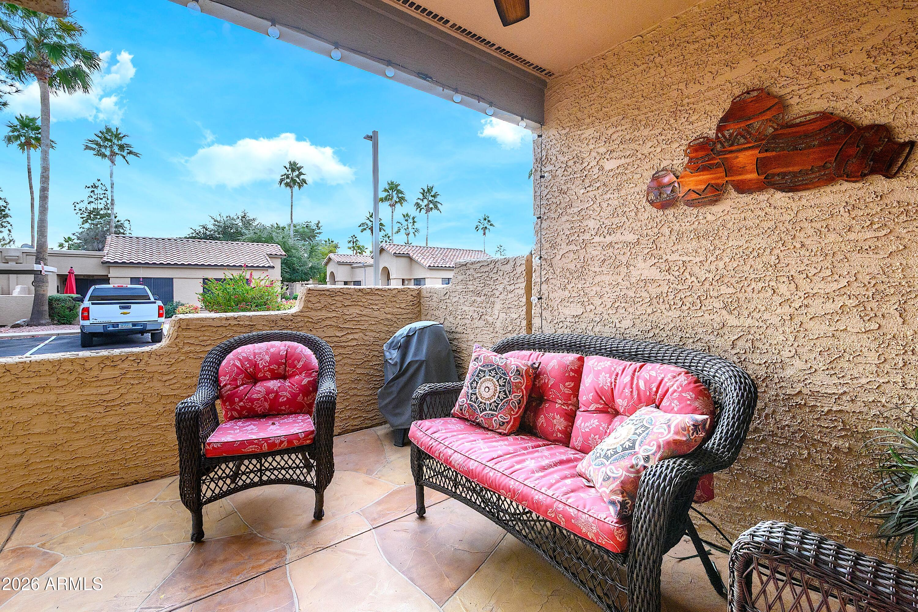 14300 West Bell Road, Unit 420 Surprise, AZ 85374 - Photo 4 of 27 a view of a chairs in a patio