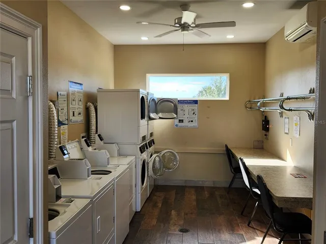a living room with furniture and a mirror