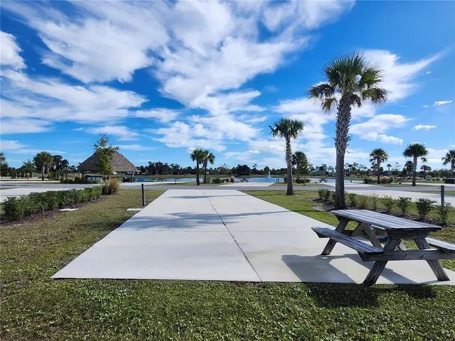 a view of a garden with sitting area