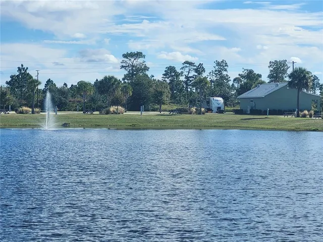 a bathroom with double vanity and a mirror