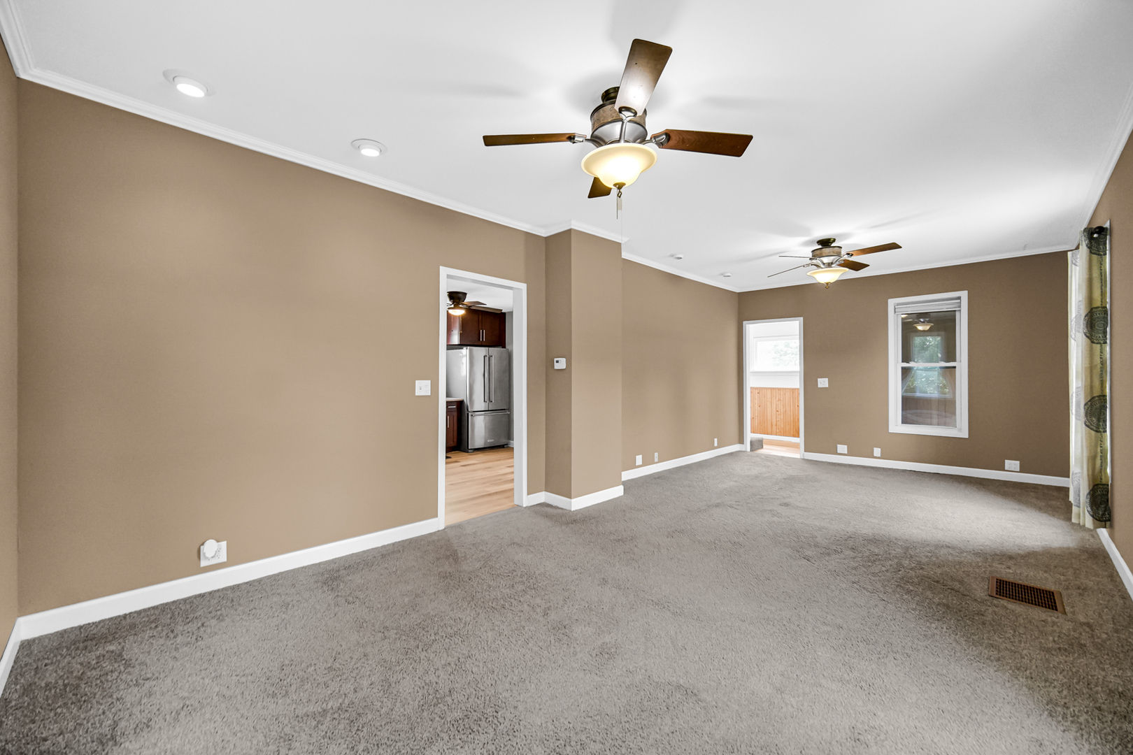 110 Wood Elwood, IL 60421 - Photo 13 of 23 a view of a livingroom with a ceiling fan and window
