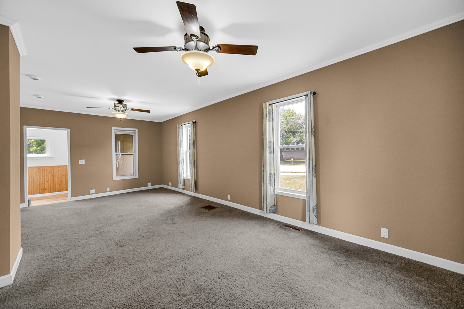 110 Wood Elwood, IL 60421 - Photo 14 of 23 an empty room with windows and fan
