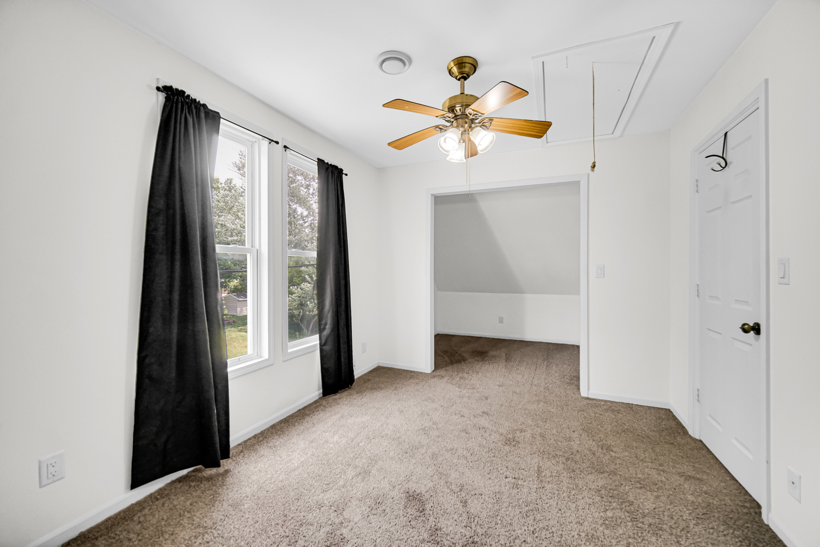 110 Wood Elwood, IL 60421 - Photo 19 of 23 an empty room with windows and fan